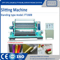 Slitting and rewinding machine with razor knife